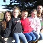 Karyn (left), Paige (7), Levi (5), Hayley (7) and Sean Julian at their Pikes Point home.