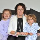 Kate Hesson, and daughters Holly (left) and Charlie spend a lot of time without husband and...