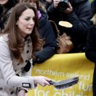 Kate Middleton flips a pancake on a visit to Belfast earlier this month.(AP Photo/Peter Morrison)