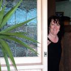 Kathy Scott enjoys the warmth of her new home after getting the cost of installing insulation and...