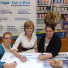 Keep it out of sight: Queen's High School Health Committee members (from left) Rebecca Webb (17),...