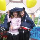 Keeping dry are Claudia Watts (7), left, and Greta Balfour (7), both of Arrowtown. Photo by Emily...