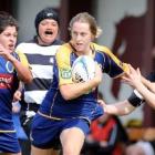 Kelly Brazier with ball in hand against Hawkes Bay at the North Ground on Saturday. Also pictured...