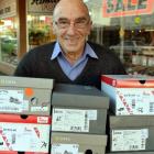 Kevin Thomas moves stock to the new Thomas Shoes store in South Dunedin before  retiring at the...