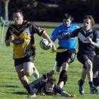 Kia Toa player Robert Dean runs with the ball during his side's Otago competition match against...