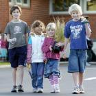 East Taieri School pupils (from left) Guy Guilford (11), Erica Siboharawai (5) and James Baker ...