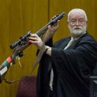 Kieran Raftery QC (above) explains that Stephen Bain left fingerprints on the murder weapon while...