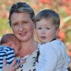 Kim Woods with children Hudson (1) and Corban (1 week) at their Glenross, Dunedin, home yesterday...