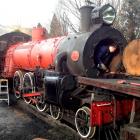 Kingston Flyer crew member George King works on the boiler of Ab 795. Photo supplied.