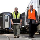 KiwiRail's Hillside workshops acting site manager Andy Bisset (left) and Kiwirail chief executive...