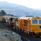 Kiwirail workers perform maintenance at Blueskin Bay, Otago. Photo by Wikimedia Commons.