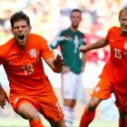 Klaas-Jan Huntelaar (L) and Dirk Kuyt of the Netherlands celebrate Huntelaar's goal against...