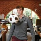 Koen Naulaerts gets in some football practice in the Dunedin Fringe Festival office yesterday....