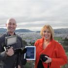 Kyle and Tania Elmer,  of Mana Property Management, with an i-Phone video rig which they use for...
