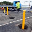 Labourer Dave Arthur works on John Wilson Ocean Dr, where contractors are installing bollards to...