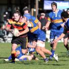 Lachie Moore (Zingari-Richmond) escapes the tackle of Taieri flanker Willis Scott at Montecillo...