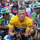 Lance Armstrong of the US waits in front of the pack of riders for the start of the 89th Tour de...