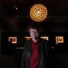 Landscape photographer Andris Apse among his Antarctic images on display at Otago Museum. Photo...