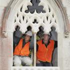 Stonemasons Marcus Wainwright and Craig Morton check the fit of part of an Oamaru stone window