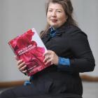 Lassig with her new book. Photo by Peter McIntosh.