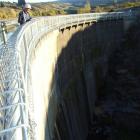 Last Chance Irrigation chairman Gavin Dann inspects damaged caused by vandals on Conroys dam,...