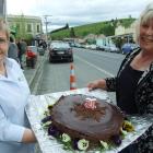 Lawrence Information Centre staff member Elsie Thompson (left) and cake-maker Kelly Aitken...