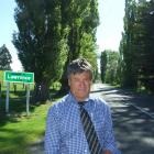 Lawrence-Tuapeka Community Board chairman Geoff Davidson with  the Lombardy poplars which line...