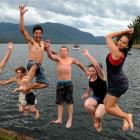 Leaping into the lake from a Te Anau waterfront wharf are from left, Aidan Waiwiri (16), Daniel...