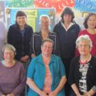Learning to speak English by singing at Literacy North Otago are, standing, from left, Yumi...