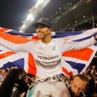 Lewis Hamilton celebrates with his team after winning the Abu Dhabi Grand Prix at the Yas Marina...