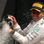 Lewis Hamilton sprays Champagne as he celebrates winning the British Grand Prix at the...