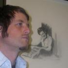 Invercargill artist Greg Lewis with a drawing of his late grandfather, Norman Lewis, one of his...