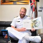 Lieutenant-commander Rob McCaw records himself reading children's books on HMNZS Otago, to send...