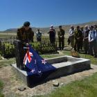 Lieutenant-general Rhys Jones unveils a plaque on the grave of Charles Risk, a World War 1...