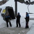 Lift staff (from left) Bruce Cocking, Jarryd Hartshorne and Adam Newman prepare the takeoff area...