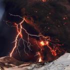 Lightning streaks across the sky as lava flows from a volcano in Eyjafjallajokul on Sunday.
