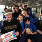 Lindsay Wright (front) and Balclutha Primary School pupils on his bus yesterday celebrate his big...