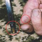 Lines on thumb and edge of magazine (circled). Photo from NZ Police.