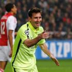 Lionel Messi celebrates scoring for Barcelona against Ajax at Amsterdam Arena stadium. REUTERS...