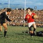 Lions fullback JPR Williams  takes on All Black flanker Ian Kirkpatrick during a test on the tour...