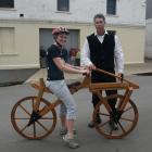 Lisa Du Fall tries out a replica of the world's oldest bike, the draisienne, watched by Greg...