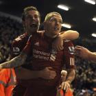 Liverpool's Craig Bellamy celebrates his goal against Manchester City with Jordan Henderson (L)...