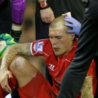 Liverpool's Martin Skrtel is treated for an injury during their Premier League match against...