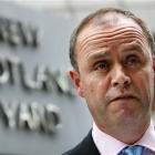 London's Metropolitan Police Assistant Commissioner John Yates stands outside the force's...