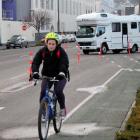 Lonely road: A cyclist navigates her way through the temporary cones being used to control...