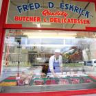 Long-serving Dunedin butcher Neville Eskrick adjusts the window display in his North Rd shop....