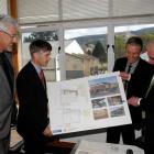 Looking at plans for John McGlashan College's new gymnasium are (from left) board of trustees...