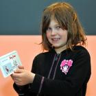 Lorelai Hunt, of Dunedin, with her newly issued chores cheque book, at the Big Value Christmas...