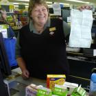 Million-dollar smile . . . Balclutha supermarket checkout operator Irene Carson, who holds a...