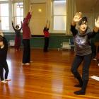 Louise Potiki-Bryant (right) warms up participants at the Oi Dance Workshop at the University of...
